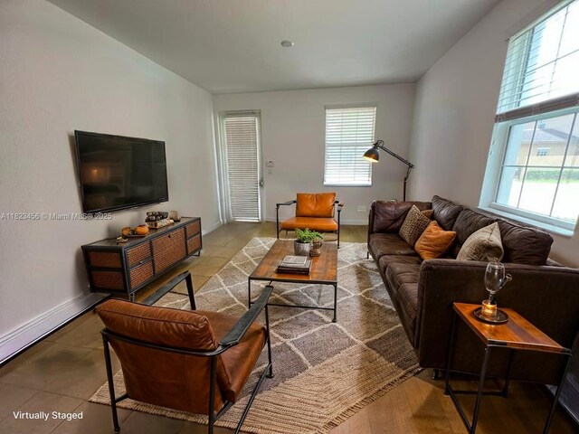 14745 SW 9th St Unit 3109, Pembroke Pines, FL 33027 - living area featuring tile patterned flooring and baseboards