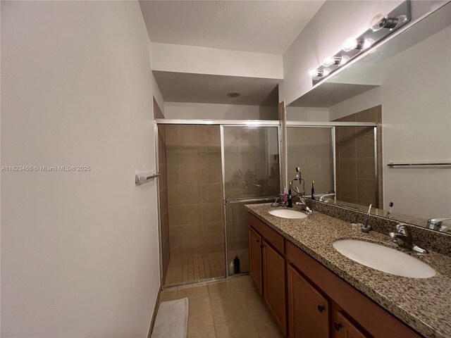 14745 SW 9th St Unit 3109, Pembroke Pines, FL 33027 - bathroom with double vanity, a shower stall, and tile patterned floors