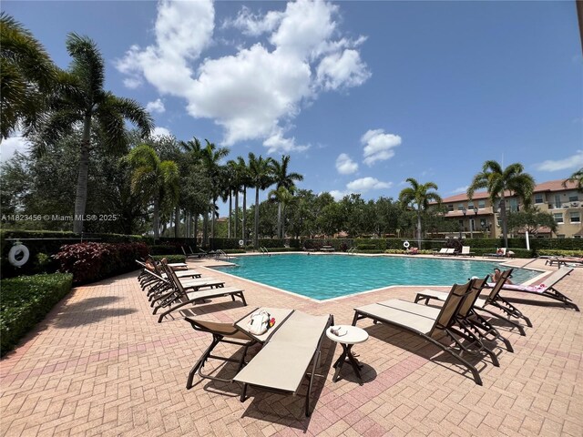 14745 SW 9th St Unit 3109, Pembroke Pines, FL 33027 - community pool featuring a patio