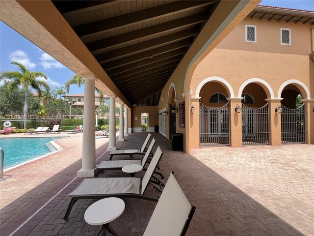14745 SW 9th St Unit 3109, Pembroke Pines, FL 33027 - view of patio featuring a community pool