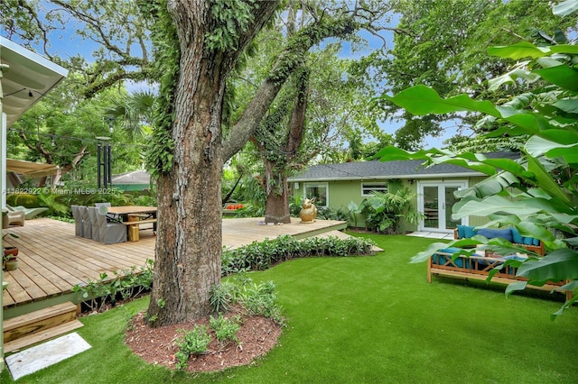 842 NW 9th Ct, Miami, FL 33136 - view of green lawn featuring a wooden deck and french doors