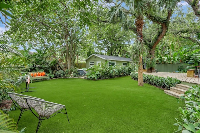 842 NW 9th Ct, Miami, FL 33136 - view of green lawn with a wooden deck