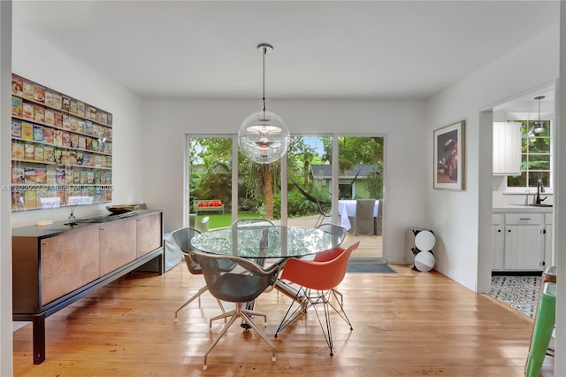 842 NW 9th Ct, Miami, FL 33136 - dining area with light wood-style floors