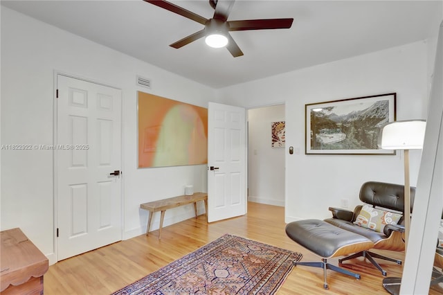 842 NW 9th Ct, Miami, FL 33136 - sitting room with a ceiling fan and wood finished floors