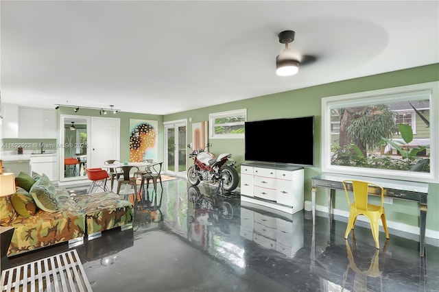 842 NW 9th Ct, Miami, FL 33136 - living area with concrete floors and track lighting