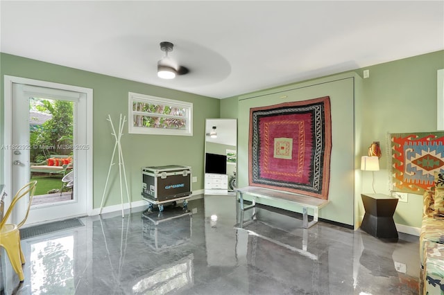 842 NW 9th Ct, Miami, FL 33136 - sitting room with baseboards and concrete flooring