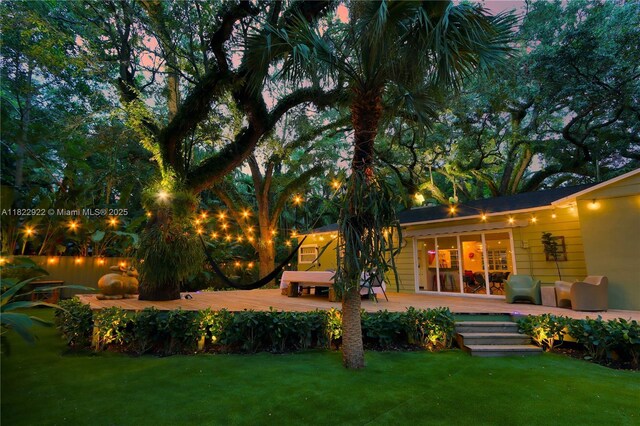 842 NW 9th Ct, Miami, FL 33136 - view of grassy yard featuring a wooden deck
