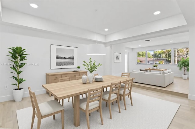 5401 Fillmore St, Hollywood, FL 33021 - dining space featuring light wood-style flooring, recessed lighting, and a tray ceiling