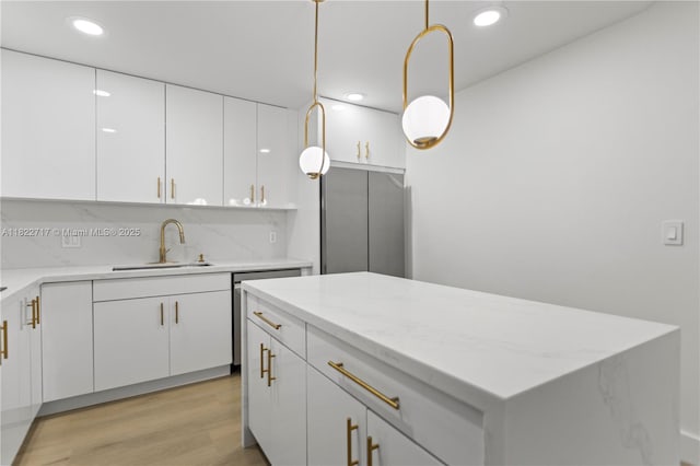 5401 Fillmore St, Hollywood, FL 33021 - kitchen with light wood-type flooring, white cabinetry, decorative light fixtures, and recessed lighting
