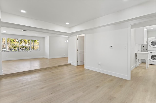5401 Fillmore St, Hollywood, FL 33021 - empty room featuring stacked washer and clothes dryer, light wood-style floors, and recessed lighting