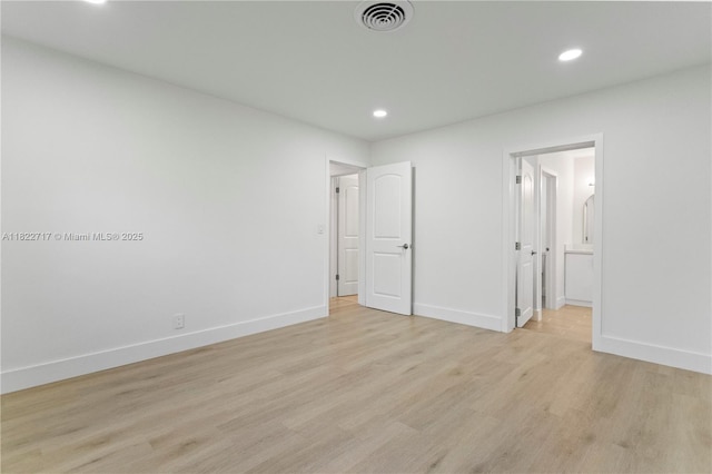 5401 Fillmore St, Hollywood, FL 33021 - unfurnished bedroom featuring light wood finished floors, recessed lighting, and ensuite bath