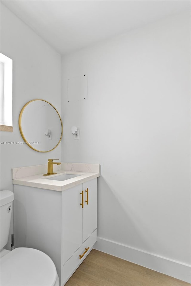5401 Fillmore St, Hollywood, FL 33021 - half bath with vanity and wood finished floors