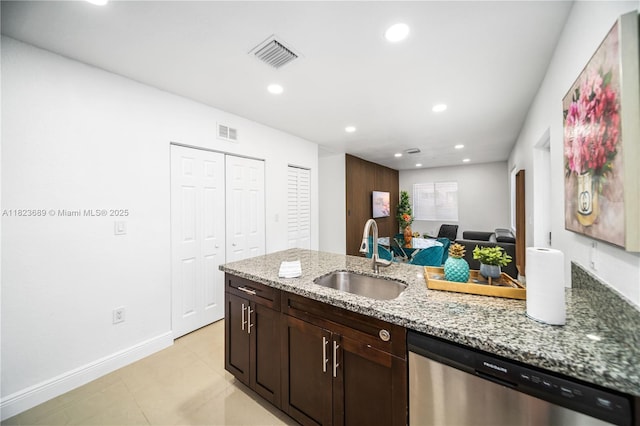 1250 NE 110th St, Miami, FL 33161 - kitchen with stainless steel dishwasher, light stone countertops, recessed lighting, dark brown cabinets, and a peninsula
