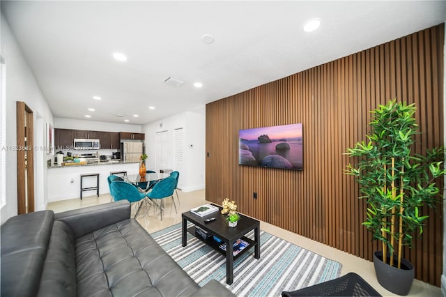1250 NE 110th St, Miami, FL 33161 - living area featuring recessed lighting and wood walls