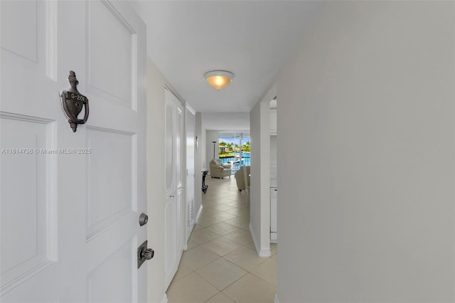 777 S Federal Hwy Unit 201G, Pompano Beach, FL 33062 - corridor with light tile patterned floors and baseboards