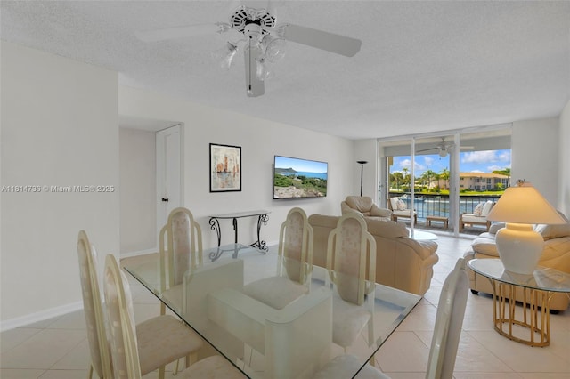 777 S Federal Hwy Unit 201G, Pompano Beach, FL 33062 - dining area with a ceiling fan, a textured ceiling, and light tile patterned floors