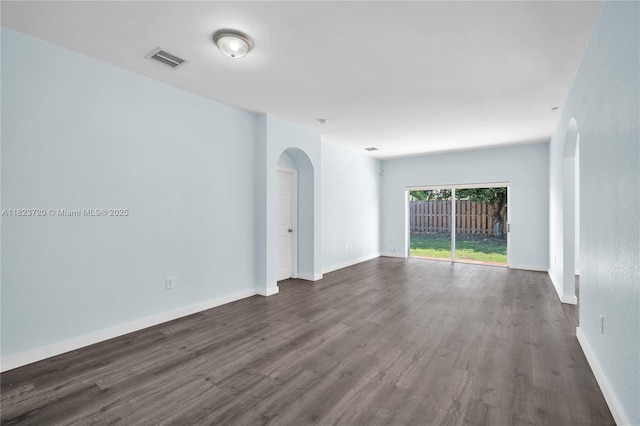 15452 SW 138th Ter, Miami, FL 33196 - unfurnished room featuring arched walkways and dark wood finished floors