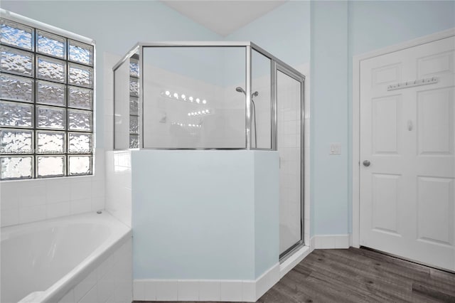 15452 SW 138th Ter, Miami, FL 33196 - bathroom with a shower stall, a garden tub, wood finished floors, and healthy amount of natural light