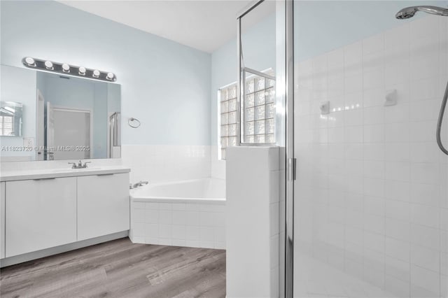 15452 SW 138th Ter, Miami, FL 33196 - full bath featuring a stall shower, vanity, a bath, and wood finished floors