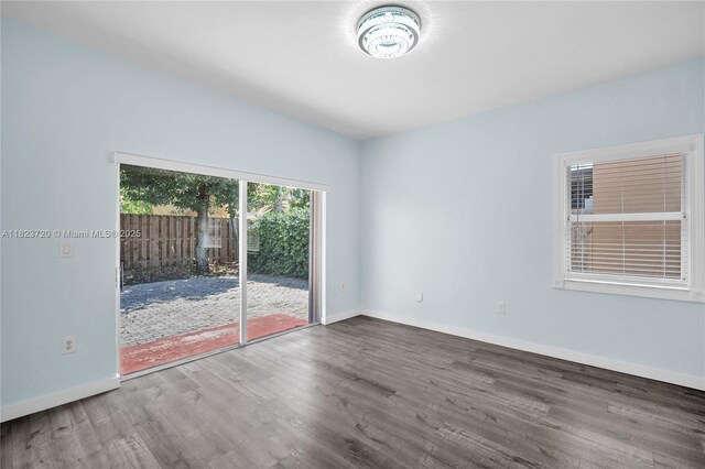 15452 SW 138th Ter, Miami, FL 33196 - spare room featuring wood finished floors