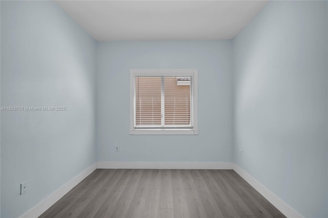 15452 SW 138th Ter, Miami, FL 33196 - empty room featuring wood finished floors and baseboards