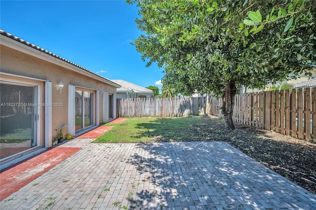 15452 SW 138th Ter, Miami, FL 33196 - fenced backyard with a patio area