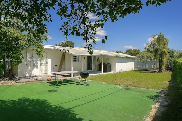 5348 W 14th Ave, Hialeah, FL 33012 - back of house with a patio area and stucco siding