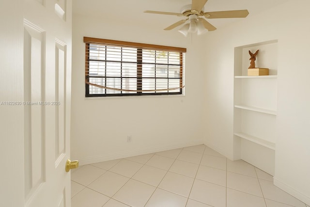 5348 W 14th Ave, Hialeah, FL 33012 - empty room with ceiling fan, light tile patterned flooring, and built in features