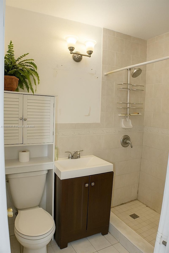 5348 W 14th Ave, Hialeah, FL 33012 - full bathroom featuring a stall shower, vanity, tile patterned floors, and tile walls