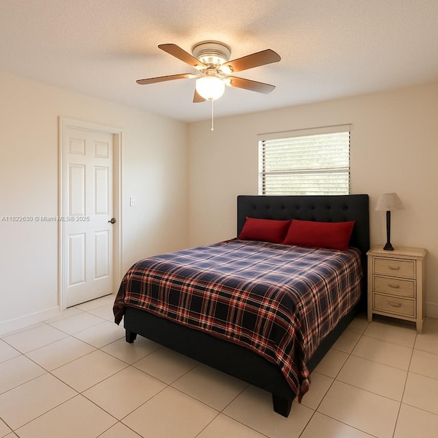 5348 W 14th Ave, Hialeah, FL 33012 - bedroom with light tile patterned floors and ceiling fan