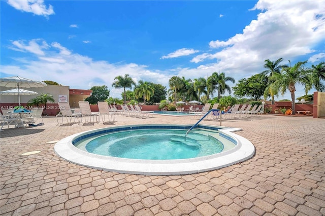 2035 SW 15th Ct, Deerfield Beach, FL 33442 - kitchen featuring freestanding refrigerator, a breakfast bar area, decorative backsplash, white cabinetry, and a kitchen island