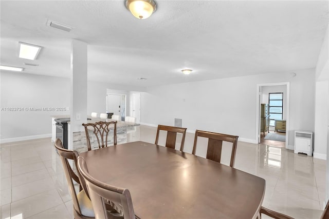 2035 SW 15th Ct, Deerfield Beach, FL 33442 - dining space with light tile patterned floors and a textured ceiling