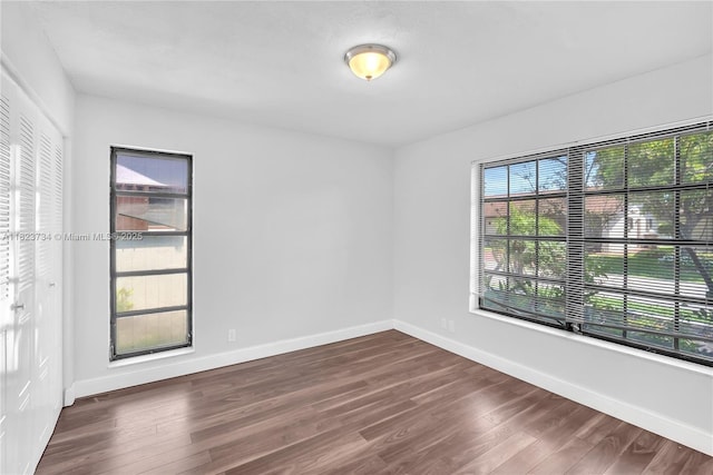 2035 SW 15th Ct, Deerfield Beach, FL 33442 - empty room featuring dark wood-style flooring and baseboards