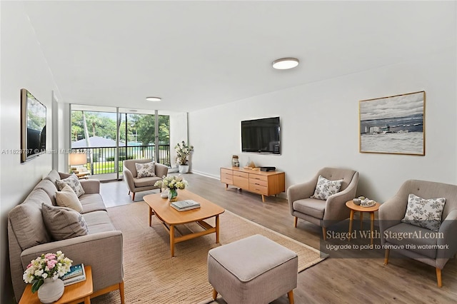 5100 SW 64th Ave Unit 204A, Davie, FL 33314 - living room with expansive windows and wood finished floors