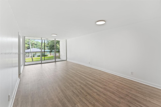 5100 SW 64th Ave Unit 204A, Davie, FL 33314 - unfurnished room featuring expansive windows and wood finished floors