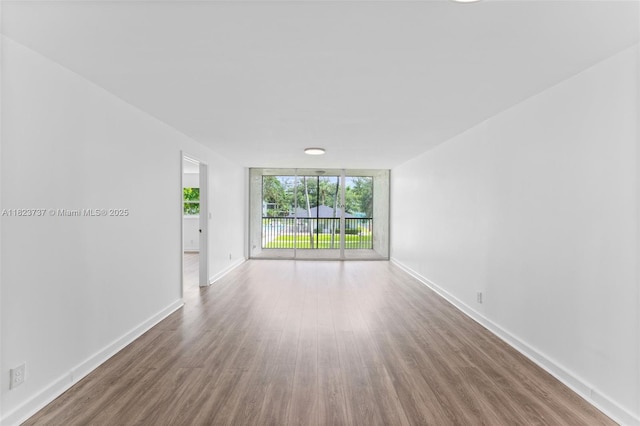 5100 SW 64th Ave Unit 204A, Davie, FL 33314 - empty room featuring wood finished floors and baseboards