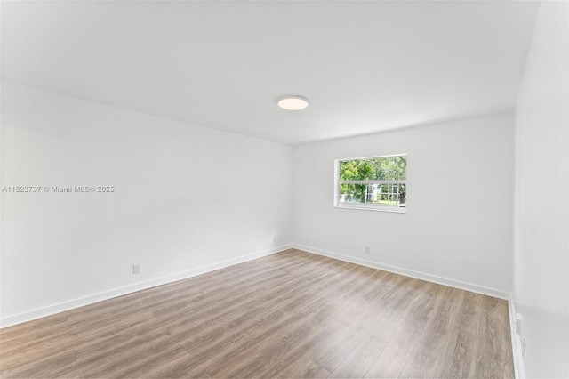 5100 SW 64th Ave Unit 204A, Davie, FL 33314 - spare room with wood finished floors and baseboards