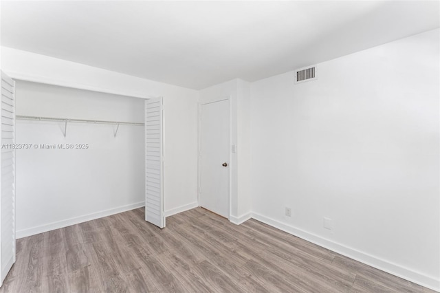 5100 SW 64th Ave Unit 204A, Davie, FL 33314 - unfurnished bedroom featuring wood finished floors and a closet