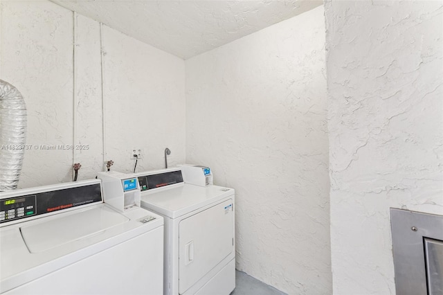 5100 SW 64th Ave Unit 204A, Davie, FL 33314 - community laundry room featuring washer and clothes dryer and a textured wall