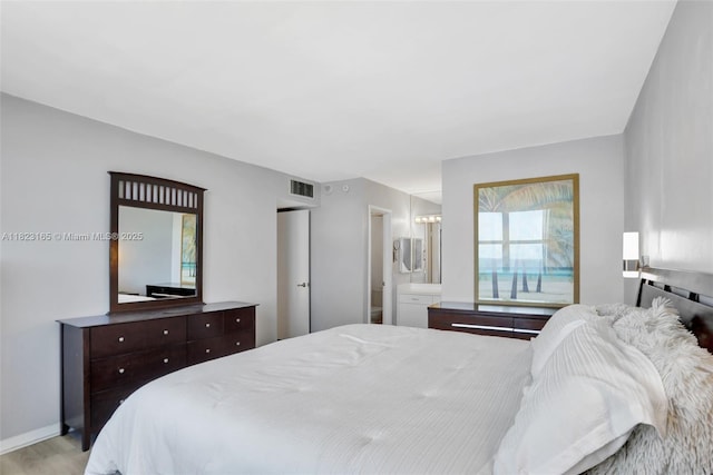 2639 N Riverside Dr Unit 1203, Pompano Beach, FL 33062 - bedroom featuring light wood finished floors and ensuite bathroom