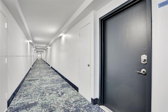2639 N Riverside Dr Unit 1203, Pompano Beach, FL 33062 - hallway with carpet and baseboards