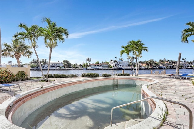 2639 N Riverside Dr Unit 1203, Pompano Beach, FL 33062 - view of pool featuring a water view and a jacuzzi