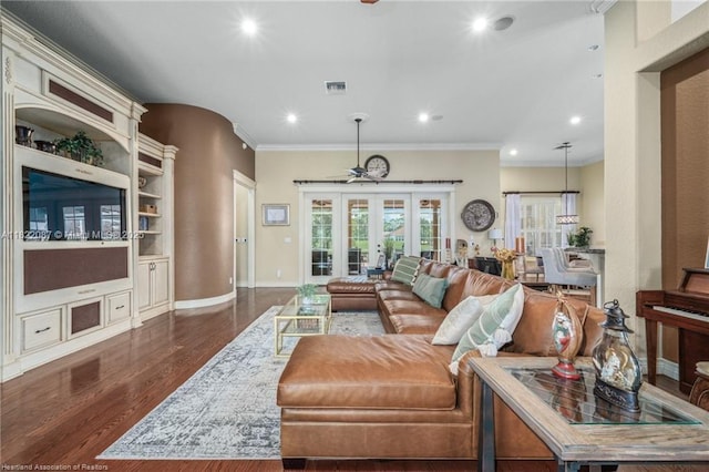 3859 Enchanted Oaks Ln, Sebring, FL 33875 - living room featuring ornamental molding, dark wood-style floors, recessed lighting, a ceiling fan, and french doors