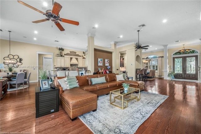 3859 Enchanted Oaks Ln, Sebring, FL 33875 - living room with ceiling fan, ornate columns, recessed lighting, wood finished floors, and ornamental molding