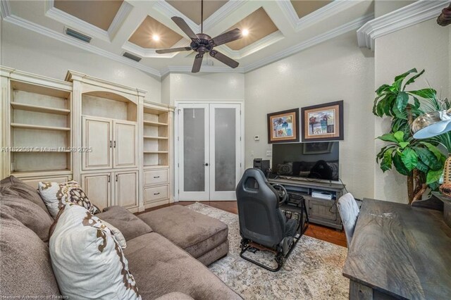 3859 Enchanted Oaks Ln, Sebring, FL 33875 - living area featuring french doors, ornamental molding, coffered ceiling, a ceiling fan, and wood finished floors