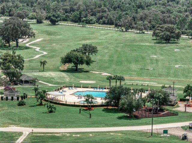 3859 Enchanted Oaks Ln, Sebring, FL 33875 - view of property's community featuring a swimming pool