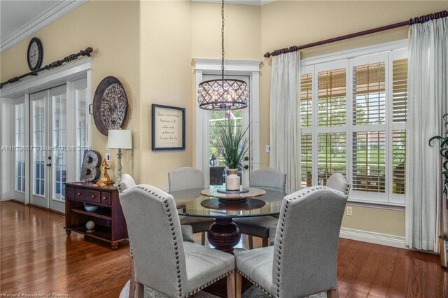 3859 Enchanted Oaks Ln, Sebring, FL 33875 - dining area featuring ornamental molding, wood finished floors, and french doors