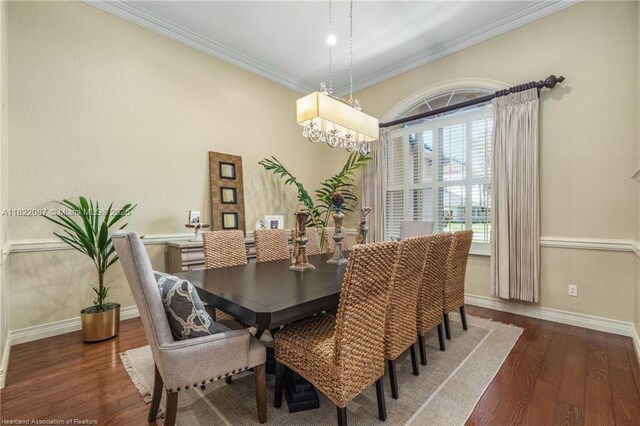 3859 Enchanted Oaks Ln, Sebring, FL 33875 - dining space with crown molding, wood finished floors, and a chandelier