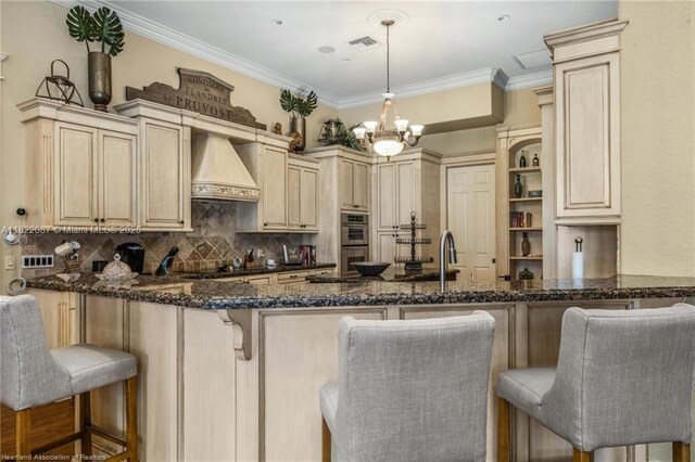 3859 Enchanted Oaks Ln, Sebring, FL 33875 - kitchen featuring custom exhaust hood, a peninsula, dark stone countertops, decorative backsplash, and crown molding