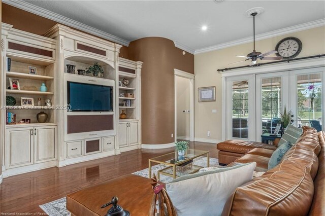 3859 Enchanted Oaks Ln, Sebring, FL 33875 - living area with crown molding, ceiling fan, and wood finished floors